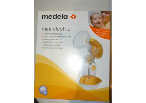 Молокоотсос Medela mini в подарок Avent овский молокоотсос и накладки для груди.